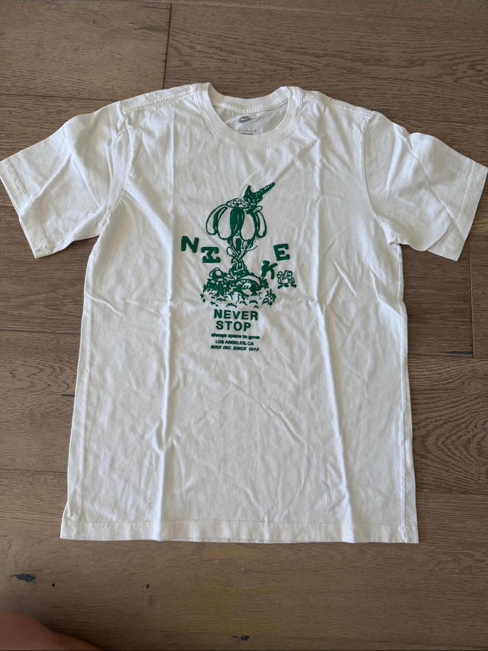 Nike White Short Sleeve Tee with Green Graphic - Never Stop